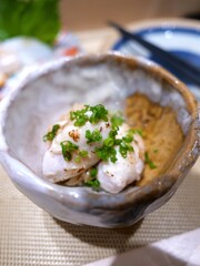 Lightly Seared Japanese Fish Sashimi with Chopped Green Onion in Ceramic Bowl
