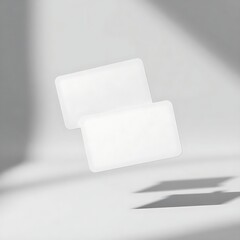 Floating blank cards present a modern and clean aesthetic ideal for product placement or showcasing minimalist designs.
