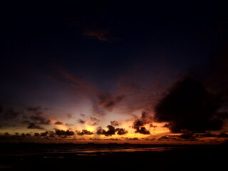 Sunset over the sea, burning like a fire 