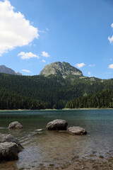 Vertical photo from the water. Black Lake in Montenegro. Panorama