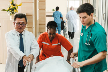 Medical team rushes a patient on a stretcher through a hospital hallway during an emergency case....