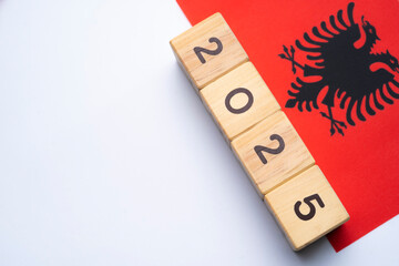 2025, Albania flag with date block, Concept, Important events for Albania the new year, election,...