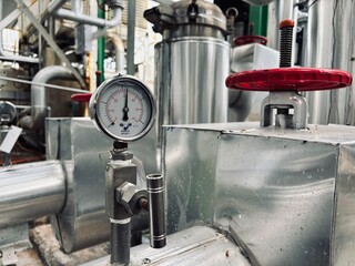  Industrial pipes, valves, and corrosion details from a factory setting. Aging metal, rust, leaks, and maintenance issues highlight the need for inspection and repair in an industrial environment.