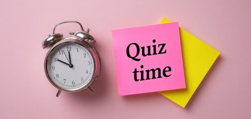 The alarm clock and colorful sticky notes for quiz preparation.