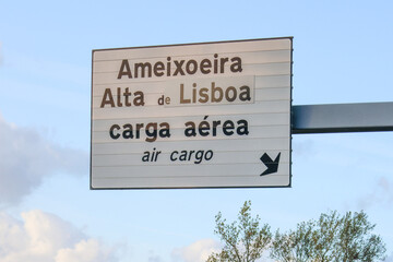 Road sign pointing to air cargo terminal at lisbon airport in portugal