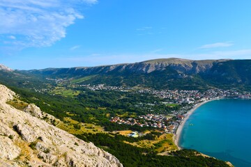Valley at Krk island and Baška town at the bay in the Adriatic sea in Kvarner, Croatia