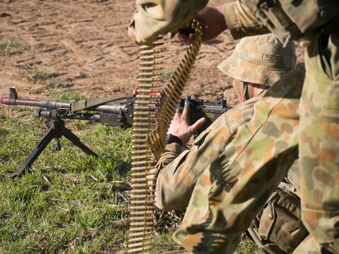 Australian Army Reserve Exercise - Soldier Lying with Gun and Bullets