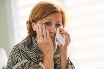 women with stress that suffer from allergies and close the nose with tissue paper. Because of...