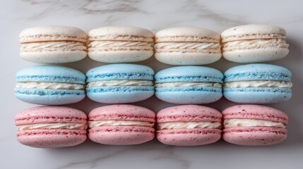 Fototapeta premium Macarons white, blue, and pink colors arranged rows marble surface