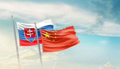 Slovakia and China flags waving in beautiful sky. Two country flag for agreement or deal. Slovakia...
