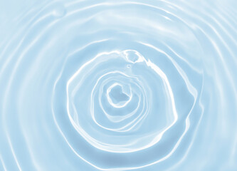 Abstract blurred shades of blue water background. Light and shadow ripples or splashes surface of water texture. Water waves with shining and reflection pattern photography for​ design artwork.