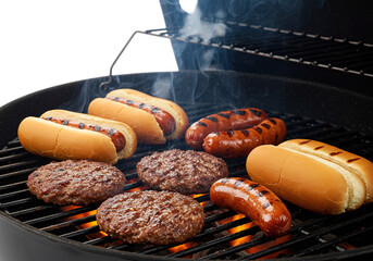 Grilled burgers, sausages, and hotdogs on a barbecue grill isolated on transparent background