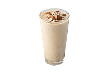 Whole vegan almond date shake in glass with nut and fruit topping on white background