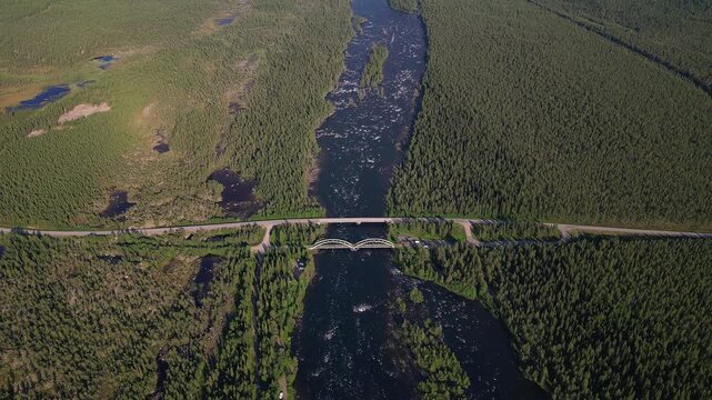 Drone footage of the E45 road bridge and nearby rail bridge crossing the Kalixalven River