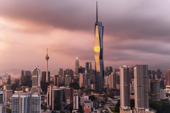 Fototapeta Golden hour sunset light embracing Kuala Lumpur city skyscrapers