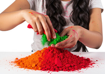 A womans hands mixing colorful holi powder for the festival isolated on transparent background