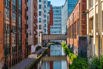 A view past tall buildings down canal street  in Manchester,UK in summertime