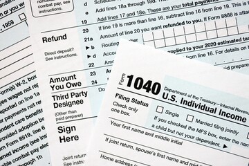 1040 US individual income tax return form blank close up. Few pages of united states tax blank
