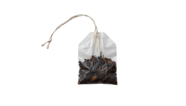 an air tight container filled with dark dried leaves, which appear to be tea, sealed with a white string that holds a small piece of paper above the leaves