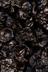 a large amount of prunes used in cooking, black prunes from small plums are dehydrated and pitted