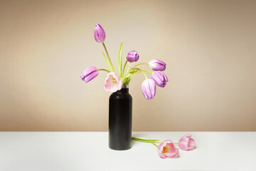 Pink and Yellow Tulips in Minimalist Black Vase