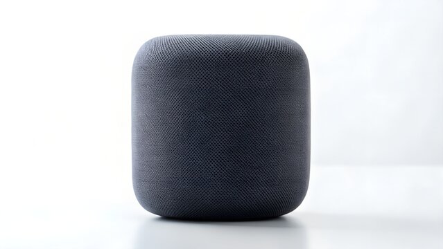 A modern gray fabric speaker isolated on white background