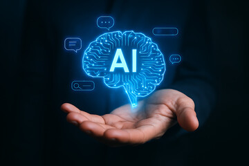 Futuristic artificial intelligence technology with holographic AI brain interface hovering above businessmans hand showing digital data processing and innovation concept
