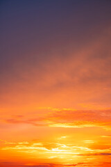 Beautiful , luxury soft gradient orange gold clouds and sunlight on the blue sky perfect for the background, take in evening,Twilight, Large size, high definition landscape photo,Vertical