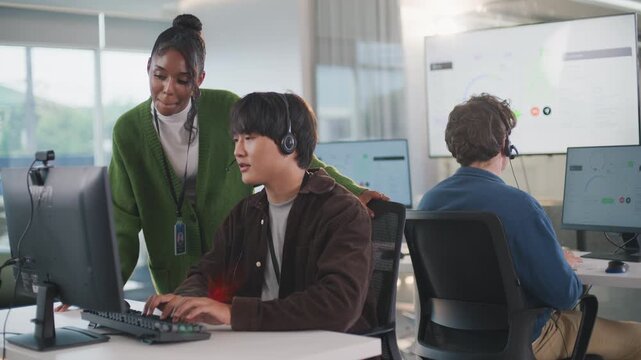 Business meeting at tech support call center office with teamwork using headsets and computers providing efficient customer support and collaboration in professional environment
