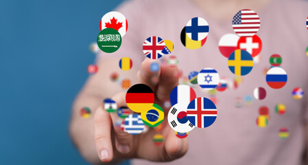 Person touching digital flags, representing international communication and global network.