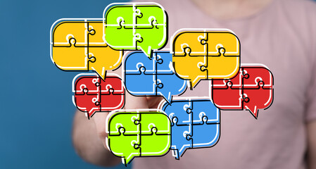 Colorful puzzle pieces in speech bubbles symbolize teamwork, communication, and collaboration.