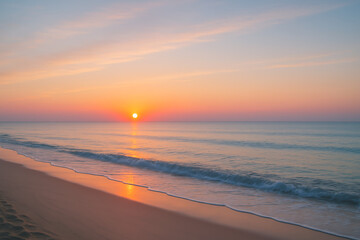 Fototapeta premium Serene sunrise over calm ocean waves illuminating sandy beach under pastel-colored sky 