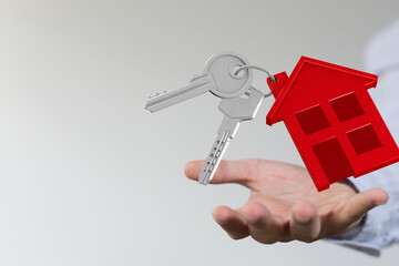 Image of house keys with a red house icon, perfect for real estate, home buying, and property...