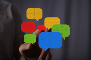 Teamwork, communication, and problem-solving. Colorful puzzle pieces represent collaboration and...