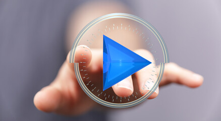 Close-up of finger pressing a play button.  Digital media, technology, and online video concept.