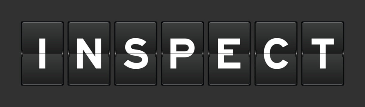Black color analog flip board with word inspect on gray background