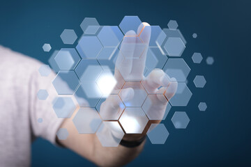 Person using futuristic touchscreen interface. Technology, innovation, digital concept.