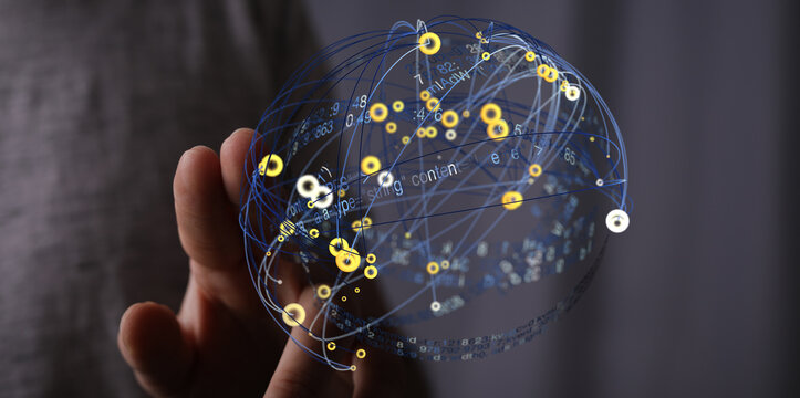 Abstract image of a hand holding a digital globe representing data connections and network.