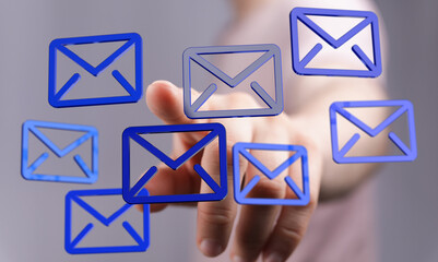 Person interacting with digital email icons, illustrating inbox management and communication.