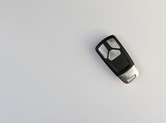 Car alarm keys placed on a white sheet of paper,