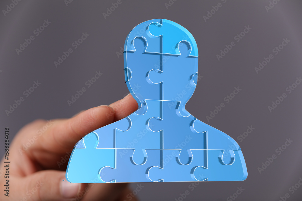 Poster abstract image of a person made of puzzle pieces. represents teamwork, problem-solving, and connecti
