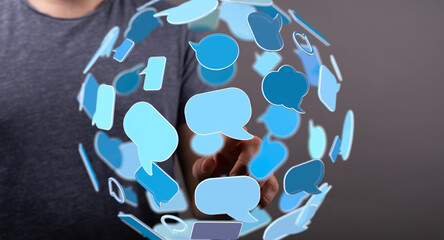 Abstract image of a person interacting with a digital sphere of speech bubbles, symbolizing global...