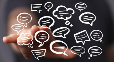 Image of hand interacting with various speech bubbles, ideal for communication, conversation, and social media concepts.