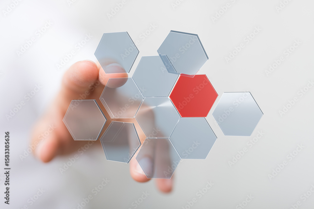 Poster abstract image of a hand interacting with a network of hexagons, one red. technology concept.