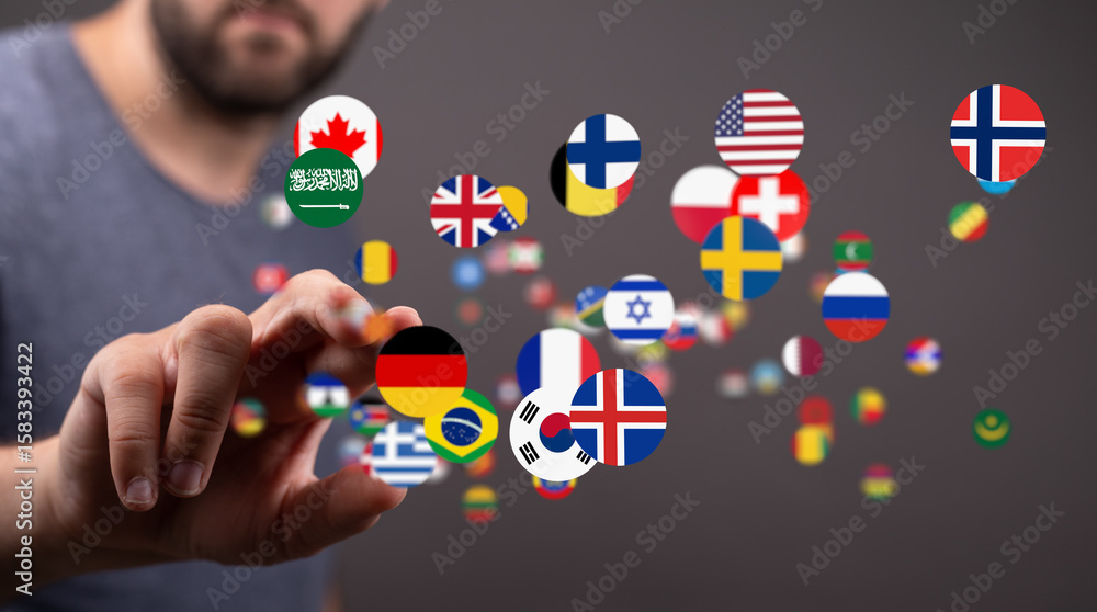 Poster a man interacts with floating flags, symbolizing global communication and international connections.