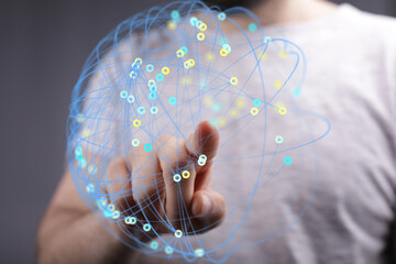 Abstract image of a person interacting with a digital network. Represents connection, global...