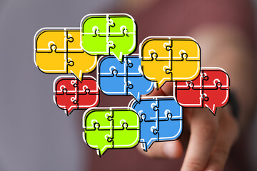 Visual concept of teamwork, communication, and problem-solving. Colorful puzzle pieces in speech...