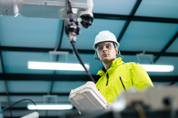 Robotic automatic technician man holding remote checking plan system of automation machine....