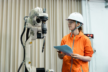 Robotic engineer women automatic mechanic with blueprint checking quality system of automation...