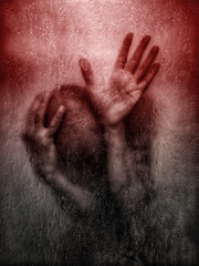 A man with hands on his head expressing fear and anxiety.
